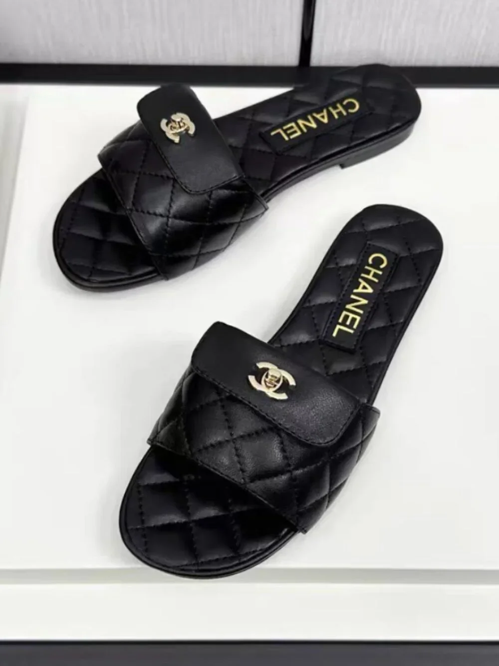 Chanel Black Quilted Lambskin CC Turn‑Lock Flat Slide Sandals